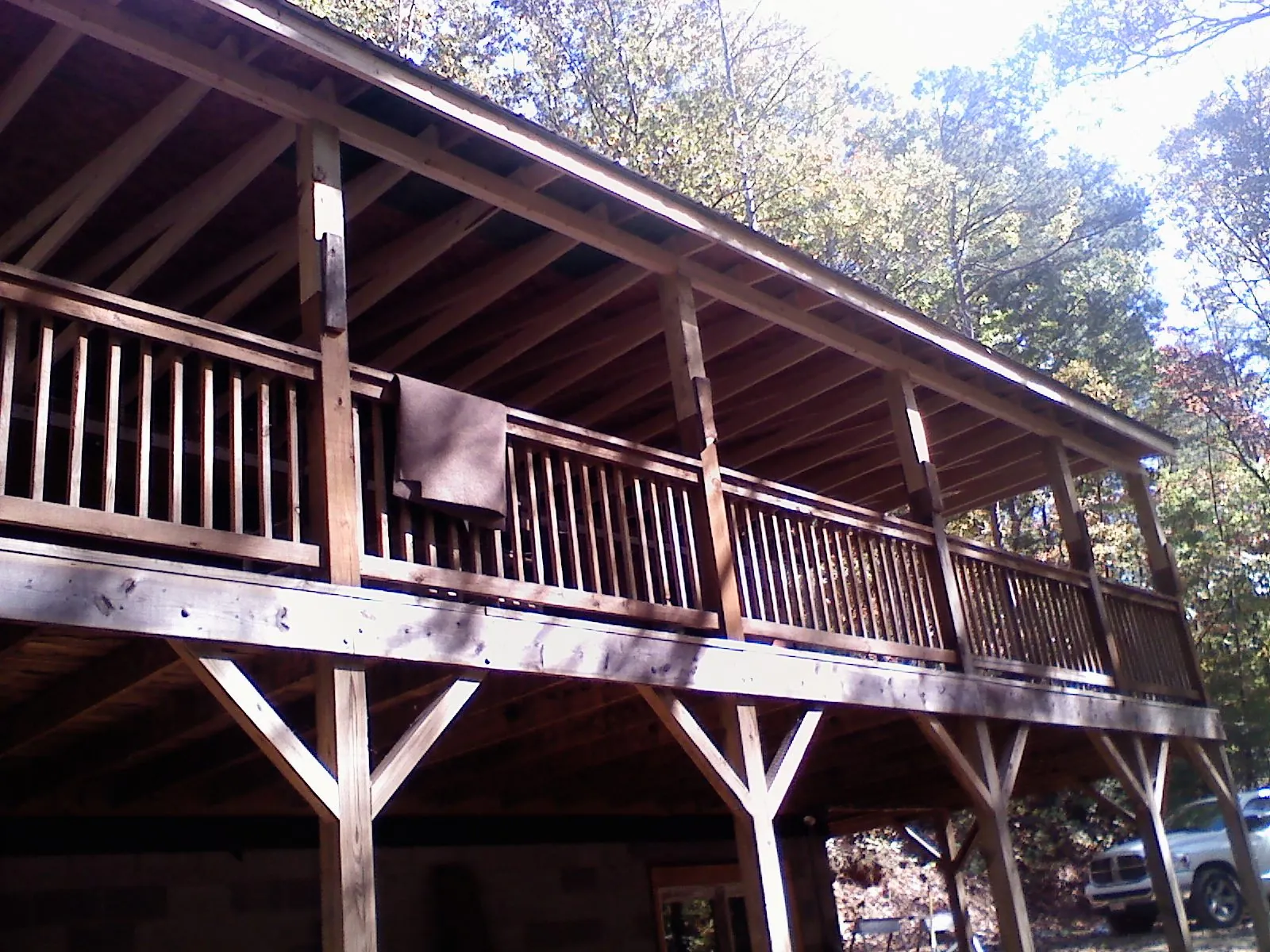 Timber framing under a new elevated porch and deck — Roof Leak Repair in Berryton by Roofing Brothers